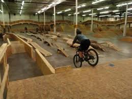 boy riding bike in indoor bike park